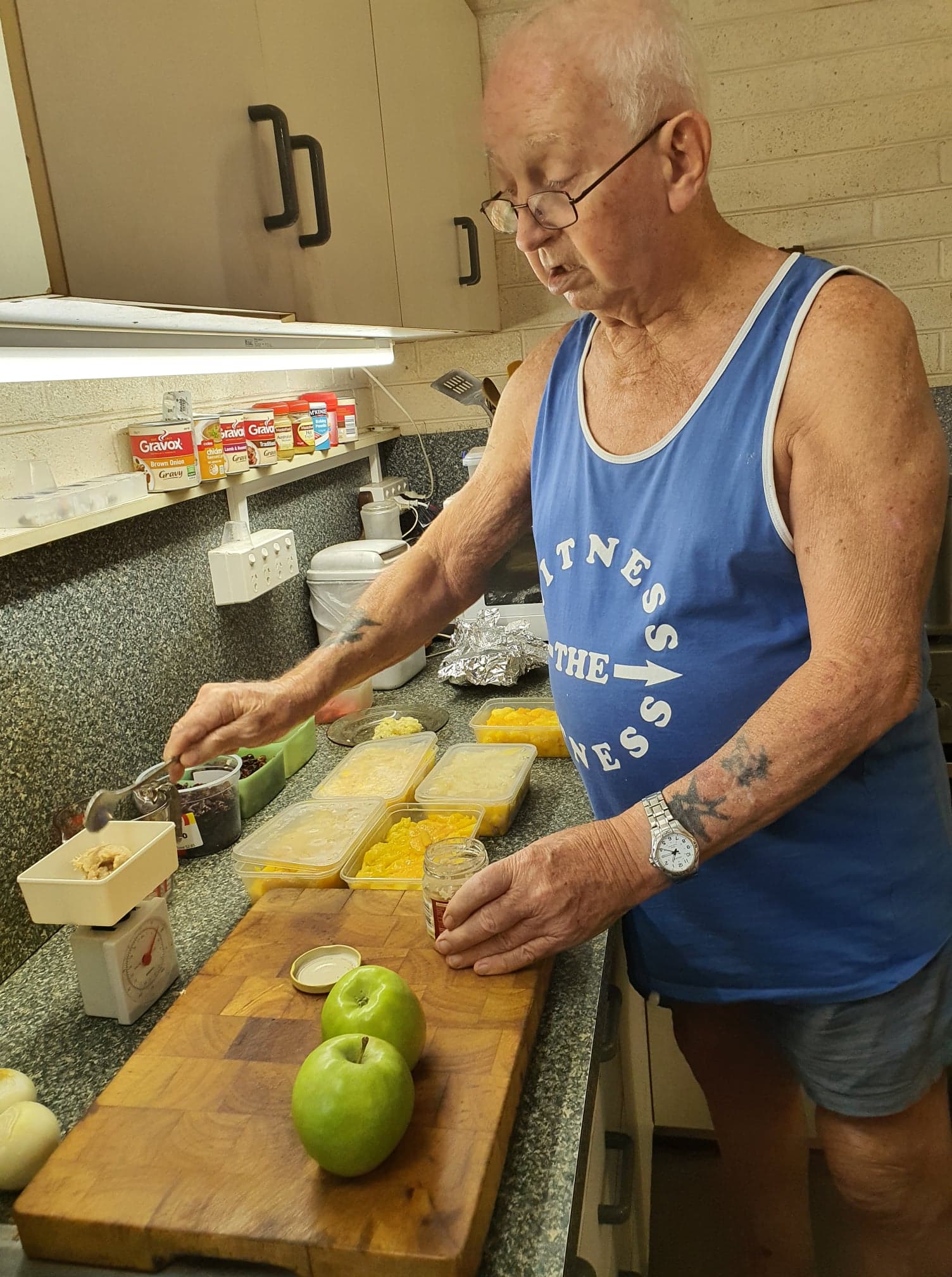 Rhond's husband measuring the ingredients