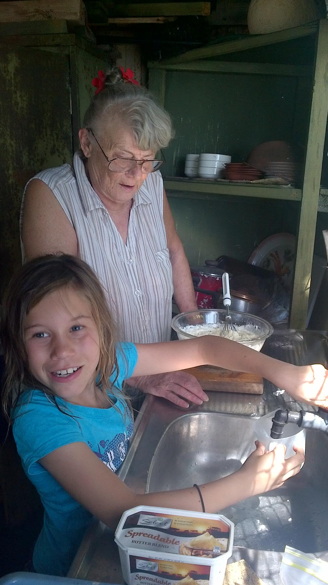 Rhondas GrandDaughter cooking with Rhonda